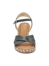 Sandalias negras con tiras cruzadas en el empeine, pulsera con hebilla al tobillo y plataforma de yute.