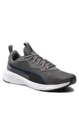 Championes deportivos Puma en color blanco, con detalles en verde y negro, diseño de malla transpirable y suela con amortiguación.