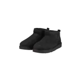 Botas cortas Ugg modelo Classic Ultra Mini de color negro, con diseño de caña baja y forro interior de piel sintética suave.
