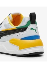 Championes deportivos Puma X-Ray en combinación de azul, gris y negro, con detalles en amarillo flúor y suela blanca y azul.