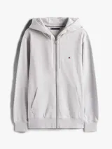 Buzo gris de felpa de algodón con capucha ajustable con cordón y cierre de cremallera frontal. Tiene dos bolsillos tipo canguro y logo de Tommy Hilfiger bordado en el pecho.