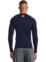 Remera térmica de compresión Under Armour, modelo HeatGear Armour, de manga larga y cuello redondo. Confeccionada en tejido ultraligero con paneles de malla estratégicos para mayor ventilación, diseño ergonómico y mangas raglán para mayor libertad de movimiento.