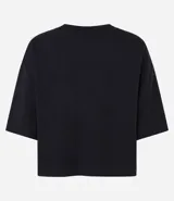 Remera cropped de manga corta, cuello redondo y calce oversized, confeccionada en tejido de algodón tipo media malla.