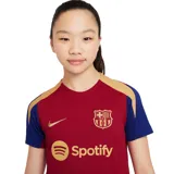 Camiseta de fútbol Nike Dri-FIT del FC Barcelona, modelo Strike. Diseño en color borgoña con mangas cortas en azul y detalles en dorado. Incluye logo de Nike, escudo del club y sponsor Spotify en el frente.