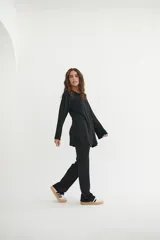 Conjunto de pantalón y blusa color beige, de punto morley.