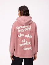 Canguro oversize color negro con efecto lavado, capucha y estampa gráfica en la espalda con tipografía desgastada y detalles en color turquesa.