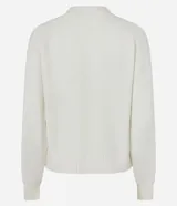 Suéter de tricot color blanco, con cuello redondo, mangas largas y terminaciones acanaladas en puños y ruedo.
