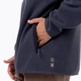 Buzo polar de media cremallera Merrell, confeccionado en microfleece de poliéster reciclado. Presenta cuello alto, bolsillo frontal con cierre y refuerzos en nylon ripstop en la zona superior del pecho. Cuenta con puños y basta elásticos para un ajuste térmico óptimo.