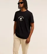 Pantalón skinny negro de sarga con elastano, estilo social, con cierre de botón y cremallera, y cintura con trabillas.