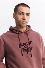 Canguro oversize de algodón con capucha y cordones ajustables. Presenta un diseño de estampa frontal con la frase 'GREAT TIMES' en relieve y bolsillo frontal tipo canguro.
