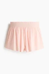 Short deportivo de doble capa color rosado con cintura elástica fruncida y calza interior con bolsillo portacelular.