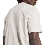 Remera de corte holgado color blanco con estampado de logos de Adidas en patrón damero. Cuello redondo y logo pequeño bordado en el pecho.
