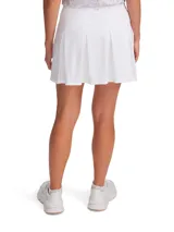 Pollera short deportiva de color blanco, confeccionada en tejido de punto ligero y elástico con tecnología de secado rápido. Cuenta con cintura alta de compresión, short interior incorporado con bolsillos laterales y bolsillos en la falda.