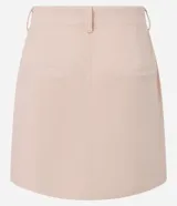 Minifalda color beige confeccionada en terciopelo cotelé, de cintura alta y corte recto.