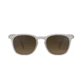 Lentes de sol Izipizi modelo Sun #E, con montura redonda color gris claro moteado y lentes marrones degradé.