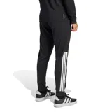 Pantalon deportivo Adidas modelo Sereno, color negro con las tres tiras características en blanco en la parte inferior de la pierna y logo de la marca en el muslo.