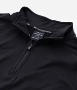 Remera deportiva térmica de hombre, color azul melange, de manga larga con corte raglán, cuello alto y cierre frontal parcial.