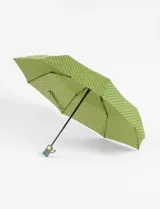 Paraguas plegable automático con estampado floral en tonos verde y negro.
