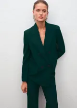 Pantalón flare verde oscuro de tiro alto, confeccionado en mezcla de lana con cintura elástica y forro interior.