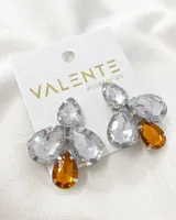 Aros colgantes con forma de flor, con engarce plateado y piedras de fantasía transparentes y ámbar.