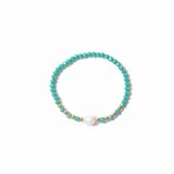 Pulsera elástica compuesta por cuentas facetadas de cristal en color verde agua, intercaladas con pequeñas esferas doradas y una perla central.