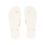 Ojotas Rip Curl color salmón con base blanca y estampa floral.