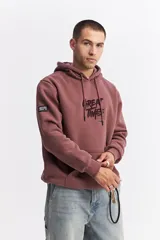 Canguro oversize de algodón con capucha y cordones ajustables. Presenta un diseño de estampa frontal con la frase 'GREAT TIMES' en relieve y bolsillo frontal tipo canguro.