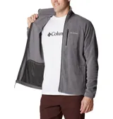 Campera de polar Columbia modelo Fast Trek II, color gris. Presenta cierre frontal completo, cuello alto, bolsillo vertical con cierre en el pecho y bolsillos laterales con cierre.