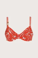 Top estilo corsetero reversible con estampado de hojas rojas y blancas, con cuentas decorativas en el escote y varillas interiores para mayor soporte.