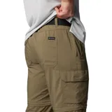 Pantalón convertible Columbia de senderismo, color verde oliva, con diseño desmontable que permite transformarlo en short. Cuenta con múltiples bolsillos, incluyendo bolsillos cargo y de seguridad con cierre, cintura parcialmente elástica y cinturón integrado.