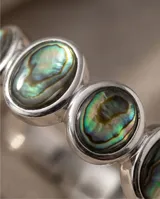 Anillo de plata 925 con incrustaciones de nácar abulón en forma circular.
