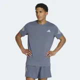 Remera deportiva Adidas Adi365 Climacool de color gris, con cuello redondo y mangas cortas. Cuenta con tecnología Climacool para absorción del sudor, las clásicas tres tiras reflectantes en las mangas y el logo de la marca en el pecho.