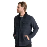 Campera tipo camisa de corte recto con diseño jacquard a rayas horizontales en tonos azul oscuro y negro. Presenta cuello camisero con forro de corderito negro, cierre frontal con botones, dos bolsillos superiores con solapa y bolsillos laterales. Confeccionada en tejido de mezcla de lana y poliéster.