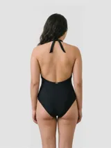 Malla enteriza negra con escote halter y diseño combinado de lycra opaca y paneles laterales transparentes.