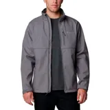 Campera cortaviento Columbia modelo Ascender, confeccionada en tejido softshell con tecnología Omni-Shield repelente al agua. Presenta diseño bicolor en tonos gris y grafito, cuello alto con protector de mentón, cierre frontal completo, bolsillos laterales y en el pecho con cremallera, y puños ajustables.