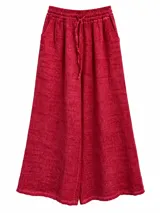 Pantalón fucsia de lino, corte amplio y relajado, con cintura elástica fruncida y cordón ajustable delantero.