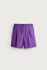 Pantalones cortos de Zara Athleticz confeccionados en tejido técnico ligero color violeta, con cintura elástica ajustable con cordón y pliegues frontales.