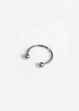 Piercing para septum de acero quirúrgico hipoalergénico con cierre de rosca y bolitas en los extremos. Grosor de 1mm.