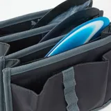 Bolso negro con logo de Rip Curl, diseñado para guardar accesorios de surf.