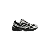 Championes Asics Gel-1130, modelo de running en color negro y crema con diseño técnico y suela amortiguada.