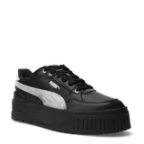 Championes urbanos Puma modelo Karmen II Idol Metallic, color negro con detalle de franja lateral plateada metalizada. Presentan una suela de plataforma robusta y diseño de caña baja.