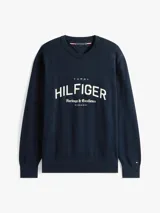 Buzo de algodón orgánico color azul marino con cuello redondo y terminaciones acanaladas. Presenta un gran logo gráfico de Tommy Hilfiger con el texto "Heritage & Excellence" y la inscripción romana "MCMLXXXV" en blanco en el frente.