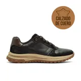 Championes casuales de cuero negro con detalles en gamuza y refuerzo en el talón color marrón. Presenta una entresuela de color tostado y suela de goma con relieve para mayor tracción.