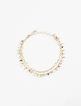 Tobillera doble dorada con cuentas de colores.