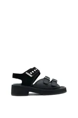 Sandalias negras de cuero con plataforma y ajuste con velcro.