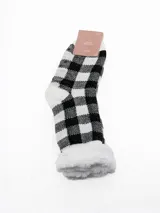 Medias de caña media con interior de sherpa, diseño a rayas horizontales multicolor y suela antideslizante con puntos de silicona.