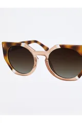 Lentes de sol Tiwi modelo Venus con montura tricolor havana/ice/coconut y lentes marrones degradé.