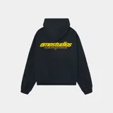 Hoodie oversize azul marino con capucha y texto estampado en la espalda en amarillo: "emestudios" y debajo "exclusive pieces selected with care".