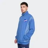 Buzo azul con medio cierre, cuello alto y escudo del Club Nacional de Football bordado en el pecho.