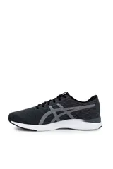 Championes deportivos Asics modelo Streetwise, color azul con diseño melange, suela blanca con detalles en naranja y el logo de la marca en tono rosado en el lateral.